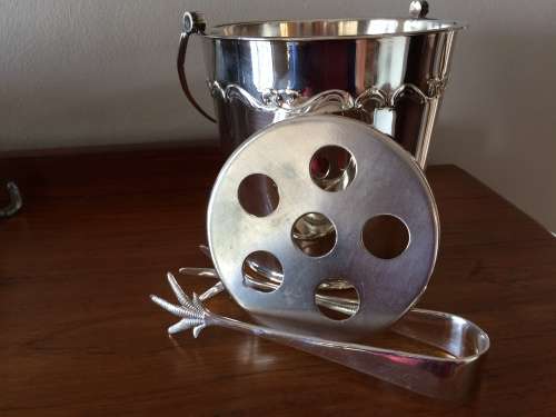 Silverplate ice bucket with strainer and tongs